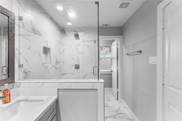11207 Wood Lodge Dr, Houston, TX 77077 - bathroom with marble finish floors, a marble finish shower, vanity, and baseboards