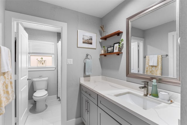 11207 Wood Lodge Dr, Houston, TX 77077 - full bath featuring vanity, toilet, and baseboards