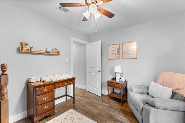 11207 Wood Lodge Dr, Houston, TX 77077 - living area with a ceiling fan, dark wood-style floors, and baseboards