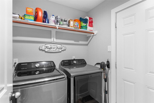 11207 Wood Lodge Dr, Houston, TX 77077 - clothes washing area with washer and clothes dryer