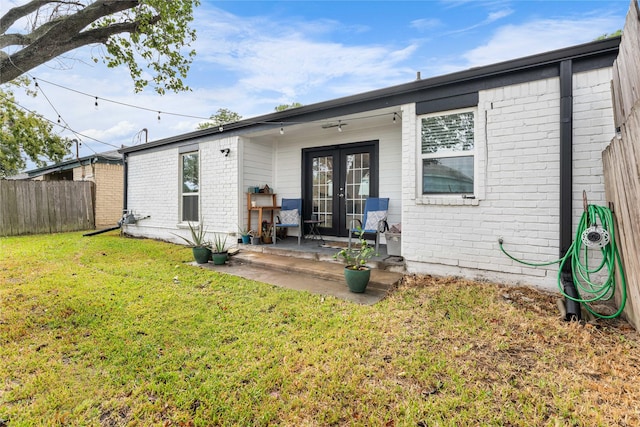 11207 Wood Lodge Dr, Houston, TX 77077 - rear view of property with french doors, brick siding, and a patio