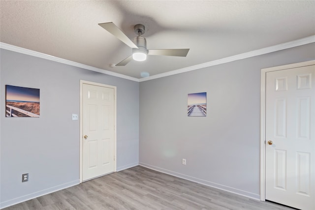 unfurnished room featuring ceiling fan, crown molding, light hardwood / wood-style floors, and a textured ceiling