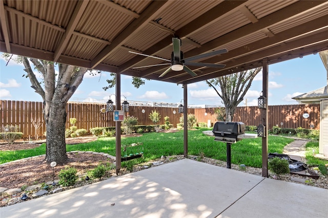 view of patio featuring ceiling fan and a grill