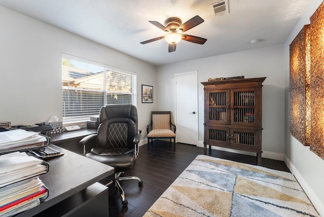 office area with ceiling fan and dark wood-type flooring