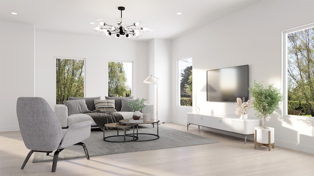 living room with light wood-type flooring, an inviting chandelier, and a wealth of natural light