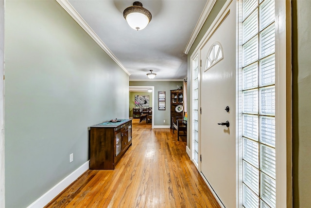 interior space featuring crown molding and light wood-type flooring