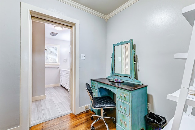 office featuring crown molding and light hardwood / wood-style floors