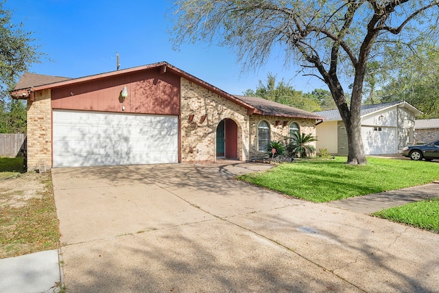 ranch-style home with a front yard and a garage