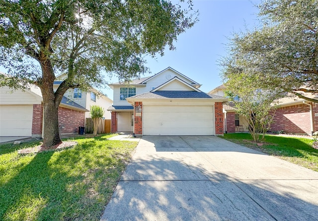 view of front of house featuring a front lawn and a garage