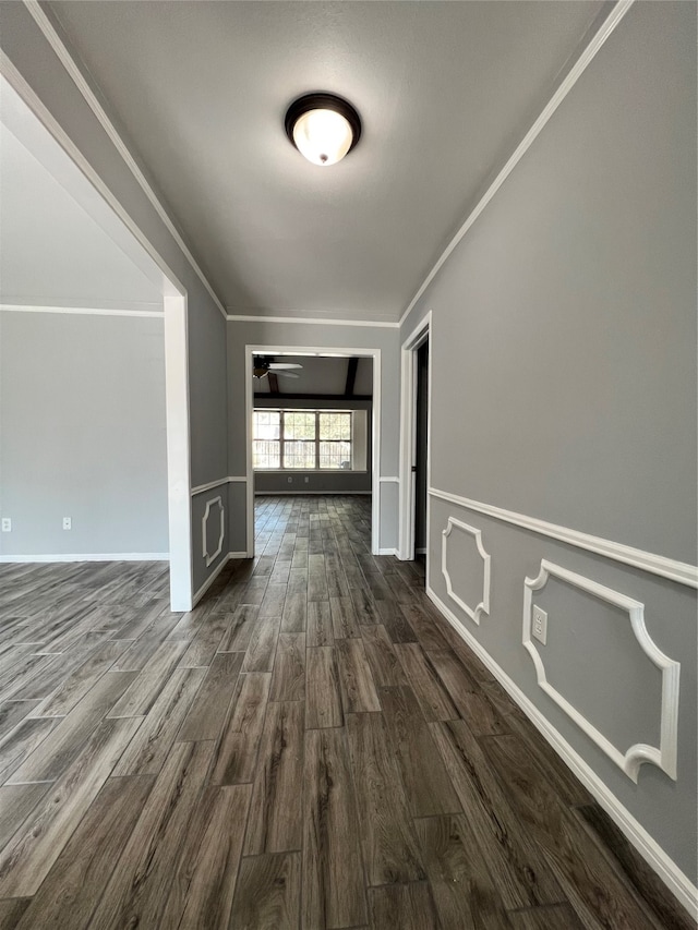 hall featuring dark hardwood / wood-style flooring and ornamental molding