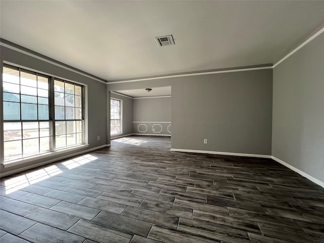 unfurnished room with dark hardwood / wood-style floors and crown molding