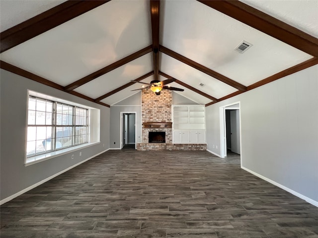 unfurnished living room with ceiling fan, a brick fireplace, vaulted ceiling with beams, built in features, and dark hardwood / wood-style floors