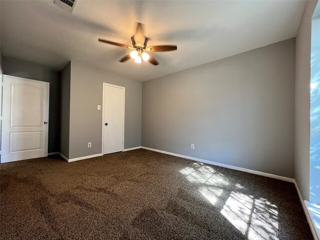 unfurnished bedroom with carpet and ceiling fan