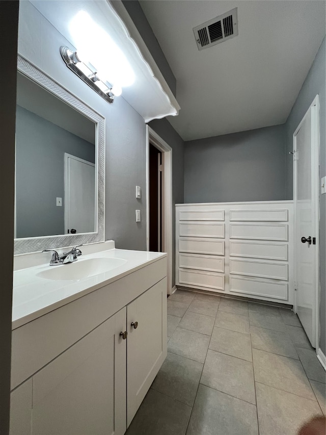 bathroom featuring tile patterned flooring and vanity