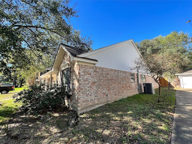 view of side of home featuring cooling unit