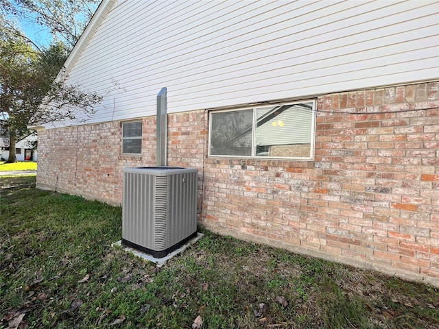 view of side of property featuring central air condition unit