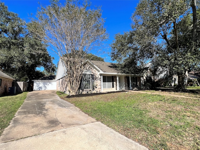 view of front of property featuring central air condition unit, covered porch, a front lawn, a garage, and an outdoor structure