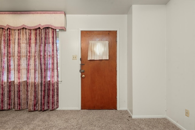 unfurnished room featuring carpet