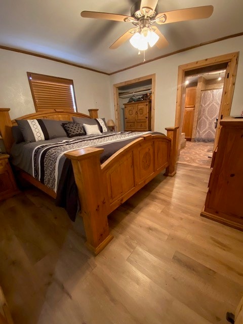 bedroom featuring ceiling fan and light wood-type flooring