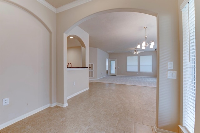 unfurnished room with a notable chandelier and ornamental molding