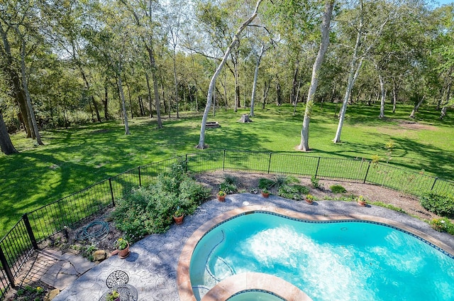 view of pool featuring a lawn