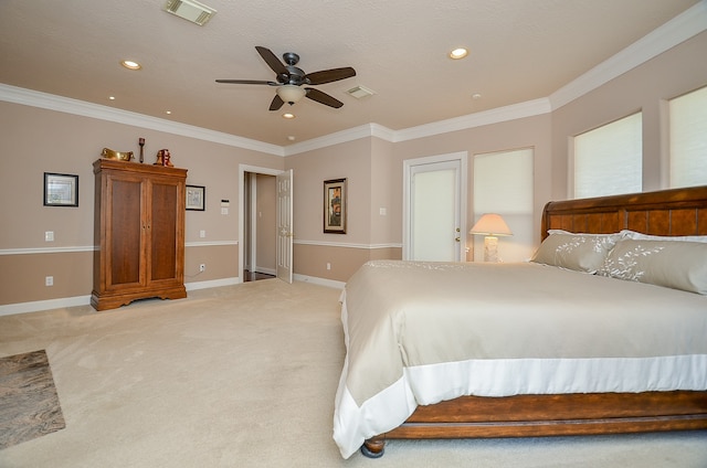 carpeted bedroom with crown molding and ceiling fan