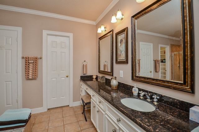 bathroom featuring tile patterned flooring, vanity, and ornamental molding