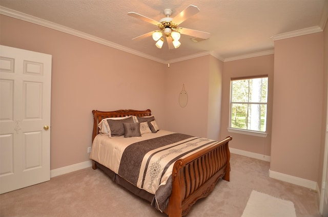 carpeted bedroom with crown molding and ceiling fan