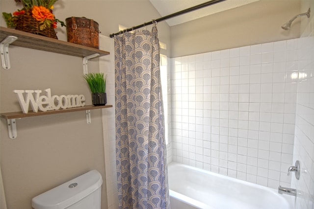 bathroom featuring toilet and shower / bath combo