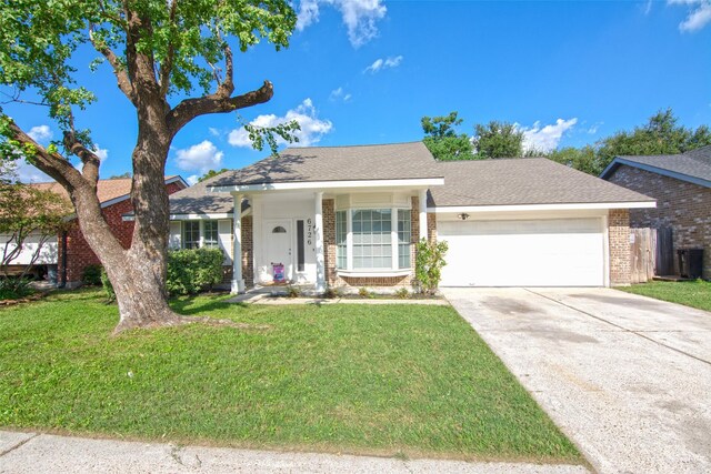 single story home featuring a garage and a front yard