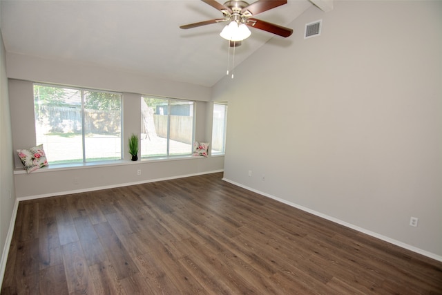 empty room featuring ceiling fan, dark hardwood / wood-style floors, and lofted ceiling with beams