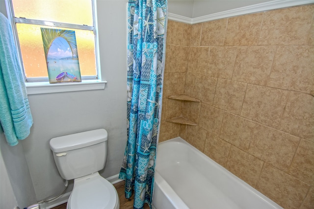 bathroom with toilet and shower / bath combination with curtain