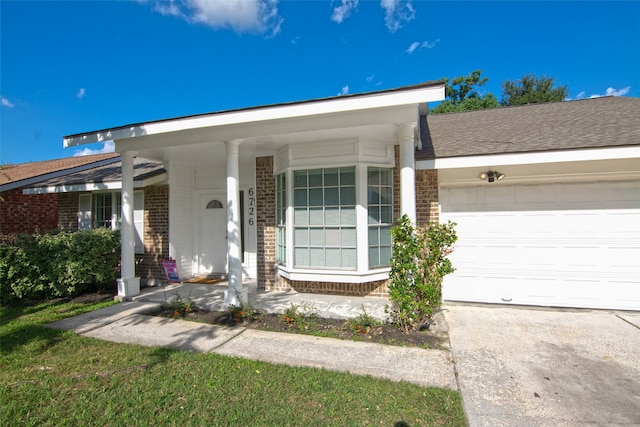 ranch-style home featuring a garage