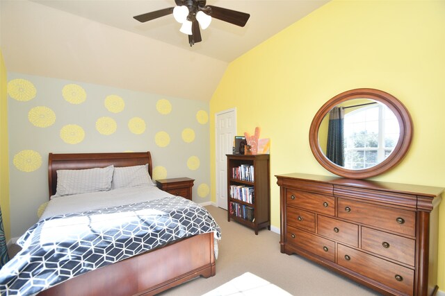 bedroom with light carpet, vaulted ceiling, and ceiling fan