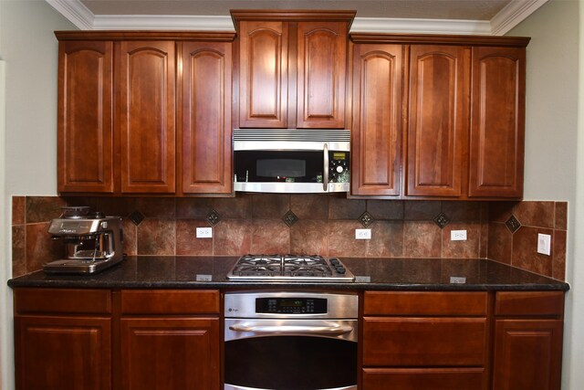 kitchen with appliances with stainless steel finishes, backsplash, ornamental molding, and dark stone counters