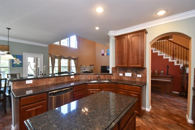 kitchen featuring tasteful backsplash, dark tile patterned floors, crown molding, sink, and dishwasher