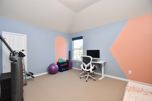 office space with vaulted ceiling and carpet