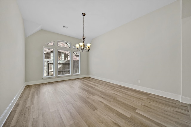 unfurnished dining area with a chandelier, light wood-type flooring, and lofted ceiling