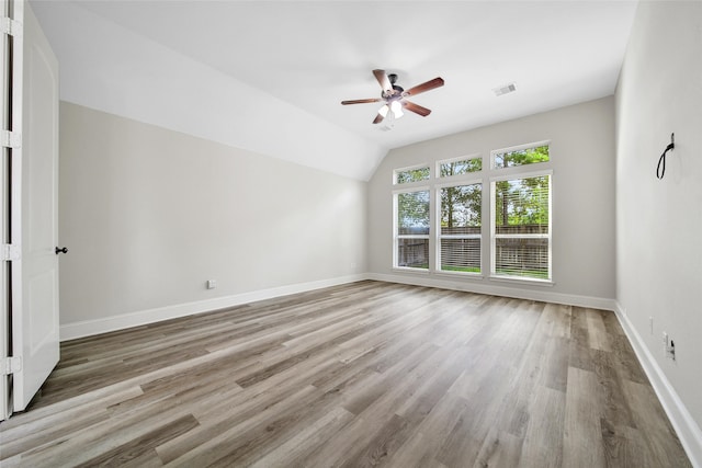 interior space featuring ceiling fan, lofted ceiling, and light wood-type flooring