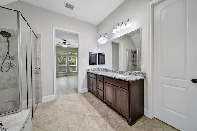 bathroom featuring vanity, ceiling fan, tile patterned floors, and walk in shower