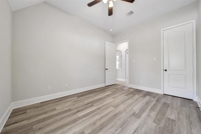 unfurnished bedroom with vaulted ceiling, ceiling fan, and light hardwood / wood-style floors