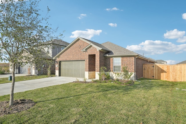 view of front of property with a garage and a front yard