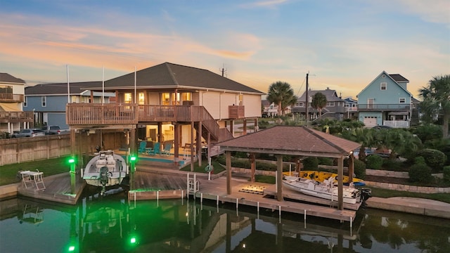 view of dock with a deck with water view