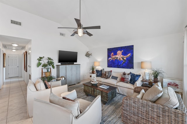 living room featuring ceiling fan, light tile patterned floors, and high vaulted ceiling