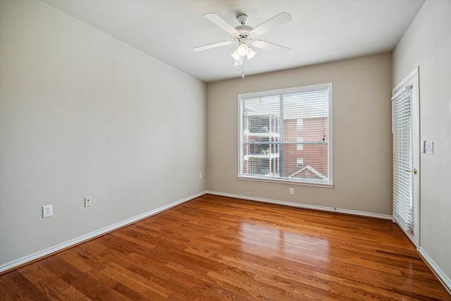 spare room featuring ceiling fan and light hardwood / wood-style flooring