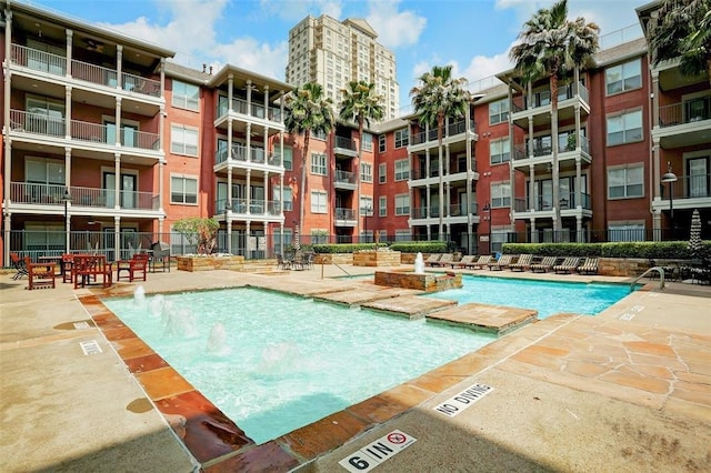 view of pool with pool water feature