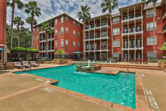 view of pool featuring pool water feature