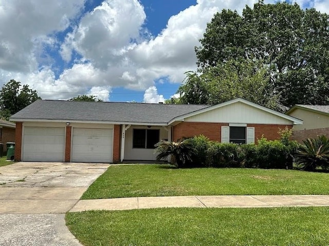 ranch-style house with a front yard and a garage