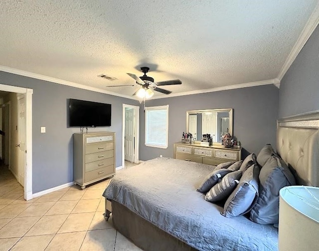 bedroom with ceiling fan, light tile patterned floors, a textured ceiling, and ornamental molding