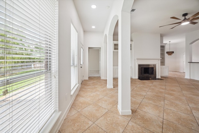 interior space featuring light tile patterned floors and a healthy amount of sunlight